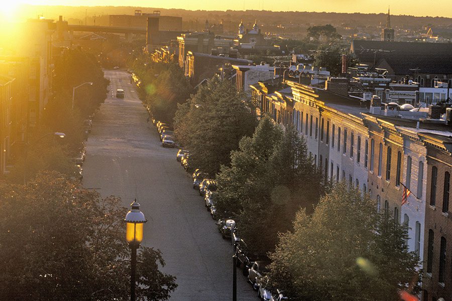 About Our Agency - View of a Quiet Residential Street in Downtown Baltimore Maryland at Sunset