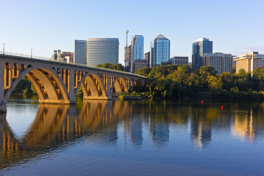 Contact - Bridge and City Skyline Over River in the Early Morning in Washington, DC